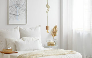 Close up of clean, white, minimalist bedroom